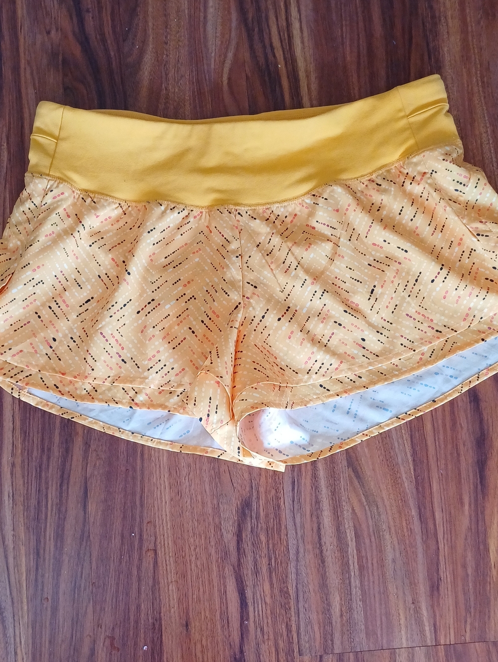 Women's Yellow Athletic Shorts with Patterned Overlay